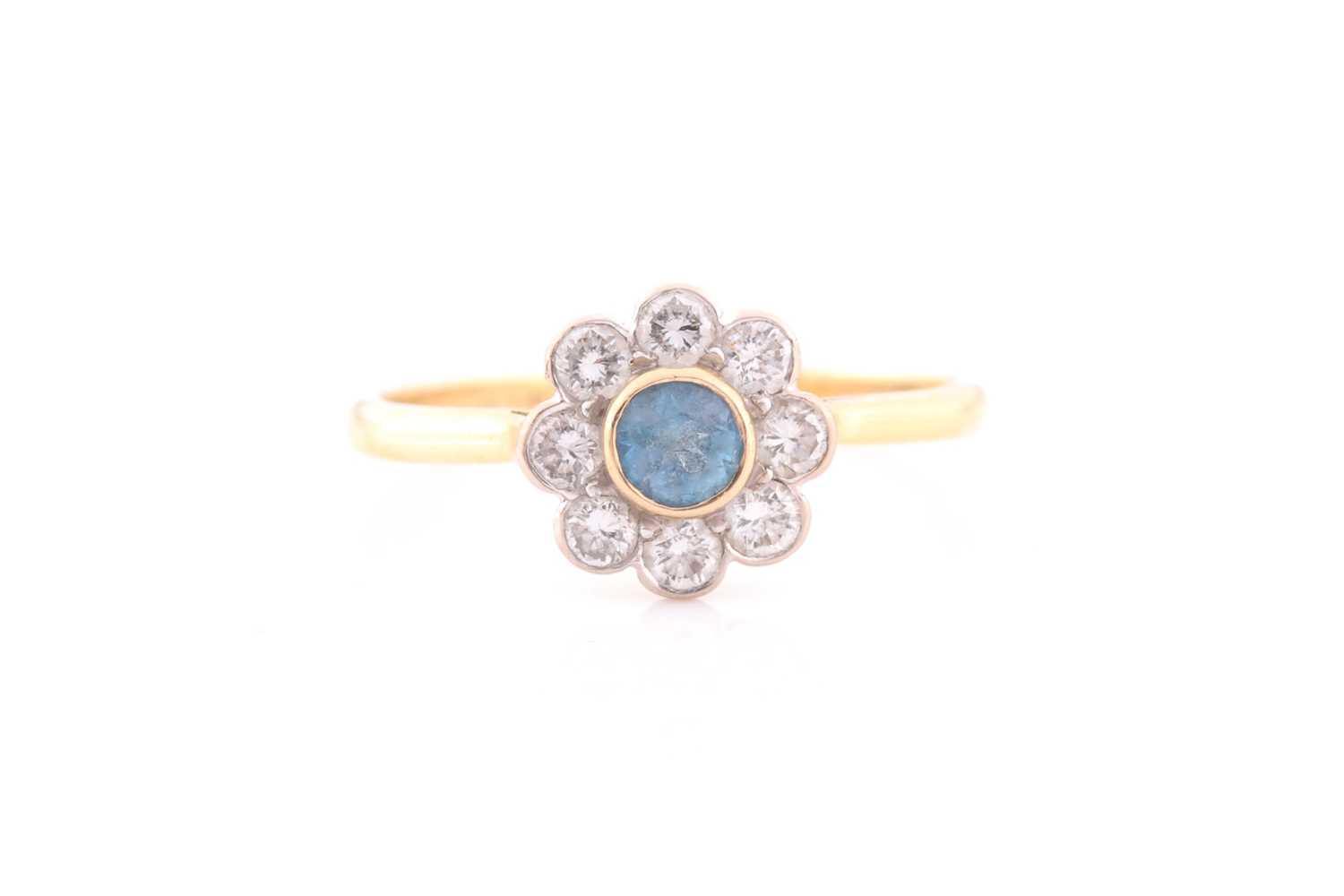 Lot 214 - A diamond and aquamarine cluster ring, the...