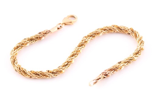 Lot 137 - A multi-strand rope twist bracelet; with...