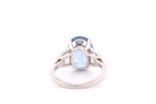 Lot 114 - A diamond and blue topaz ring, set with a...