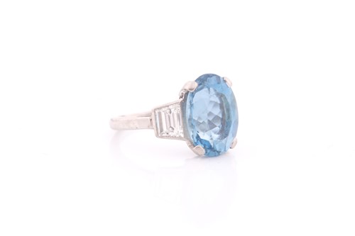 Lot 114 - A diamond and blue topaz ring, set with a...