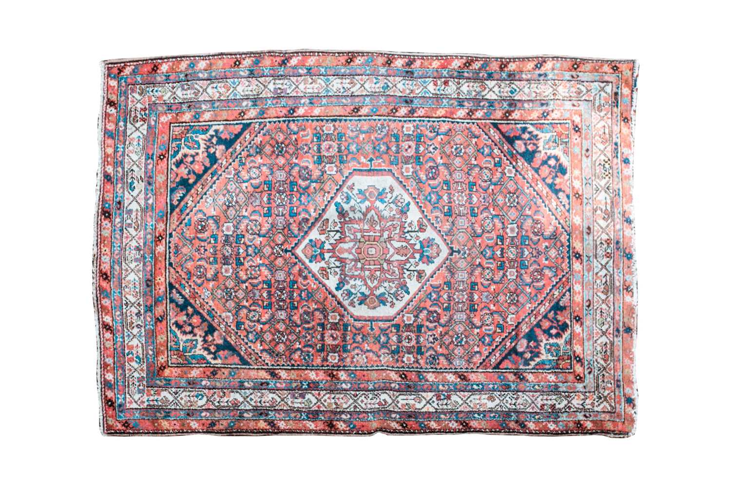 Lot 355 - A 20th-century tomato red ground Hamadan rug...