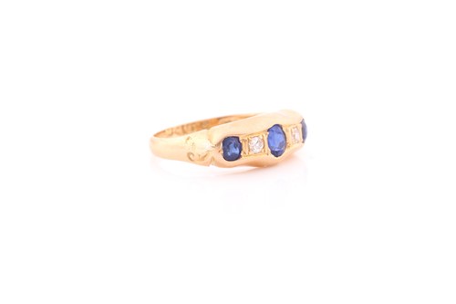 Lot 124 - An 18ct yellow gold, diamond, and synthetic...