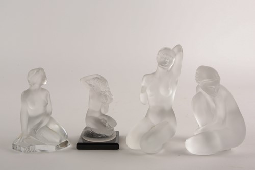 Lot 516 - A group of four Lalique colourless frosted...
