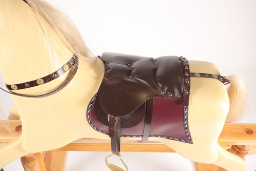 Lot 316 - A carved and painted cremello rocking horse...