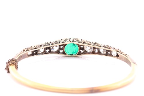 Lot 232 - A Victorian yellow gold, diamond, and emerald...