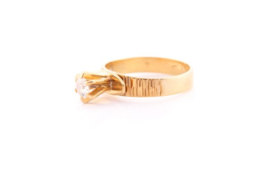 Lot 48 - An 18ct yellow gold and diamond ring, set with...