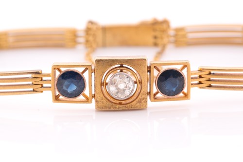 Lot 128 - A yellow metal, diamond, and sapphire bracelet,...