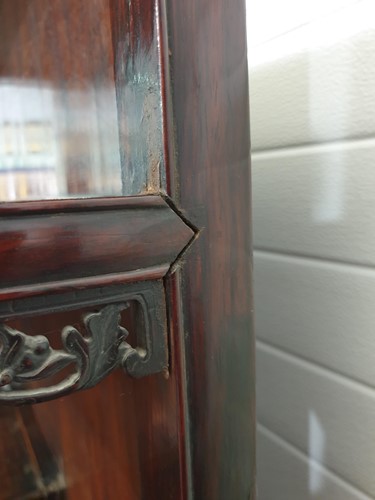 Lot 137 - A Chinese carved and pierced rosewood cabinet,...