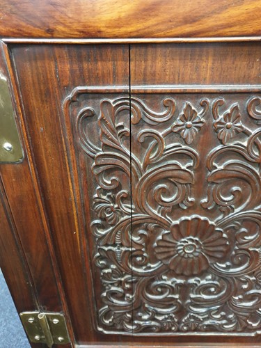 Lot 137 - A Chinese carved and pierced rosewood cabinet,...