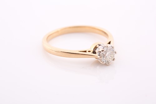 Lot 109 - An 18ct yellow gold and solitaire diamond ring,...