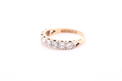 Lot 144 - An 18ct yellow gold and diamond half hoop ring,...