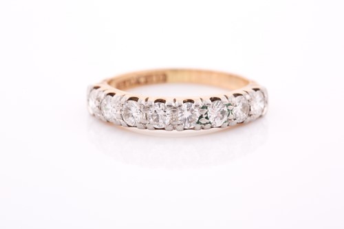 Lot 144 - An 18ct yellow gold and diamond half hoop ring,...