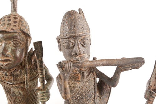 Lot 202 - A pair near of Benin bronze seated warriors,...