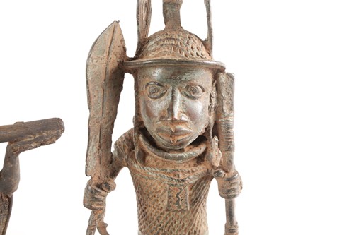 Lot 202 - A pair near of Benin bronze seated warriors,...
