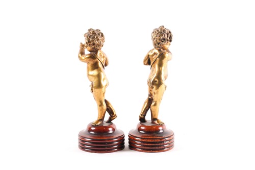 Lot 212 - After Clodion, a pair of gilt bronze figures...