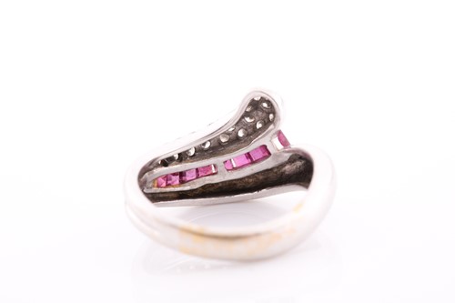 Lot 119 - An 18ct white gold, diamond, and ruby ring, of...