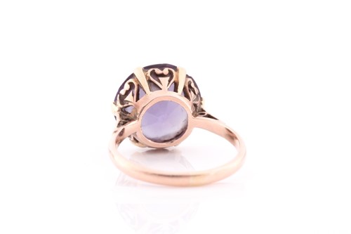Lot 140 - A singe stone synthetic corundum dress ring;...