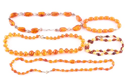Lot 222 - A butterscotch coloured amber-style beaded...