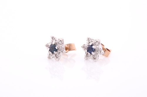 Lot 314 - A pair of diamond and sapphire floral cluster...