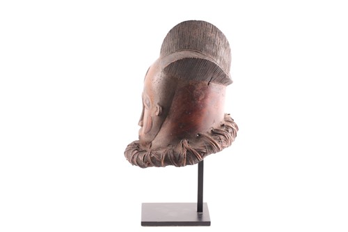 Lot 221 - A small Baule helmet mask, Ivory Coast, the...