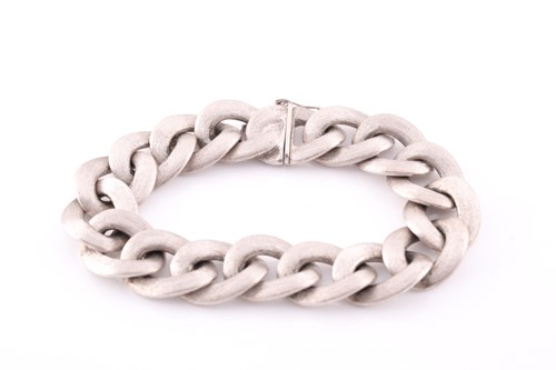 Lot 198 - A white metal curb-link bracelet, with...