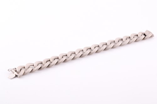 Lot 198 - A white metal curb-link bracelet, with...