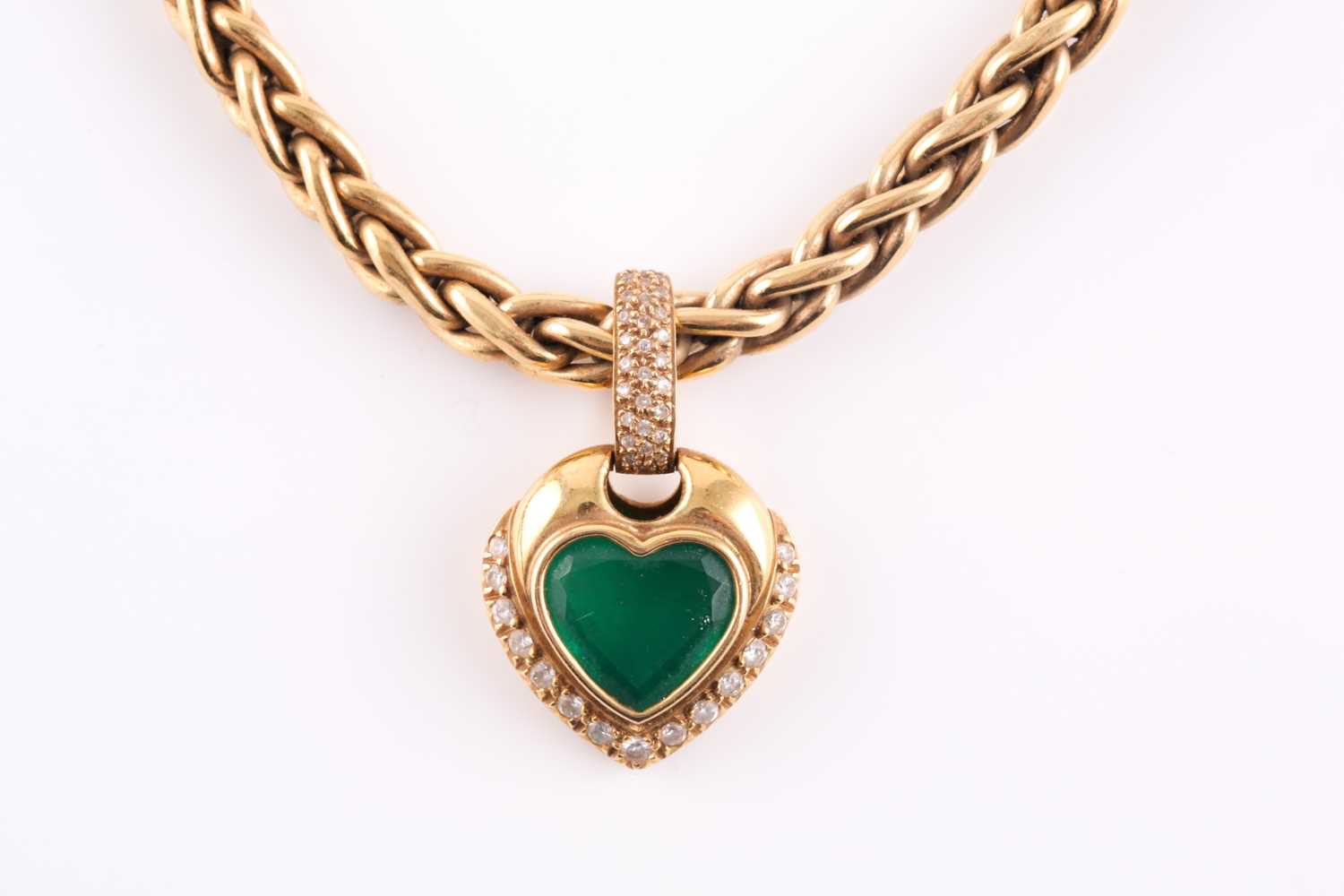 Lot 60 - An 18ct yellow gold, diamond, and green stone...