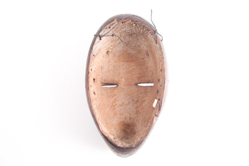 Lot 227 - A Dan mask, Ivory Coast/Liberia, the forehead...