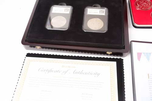 Lot 317 - Seven boxed commemorative coin sets,...