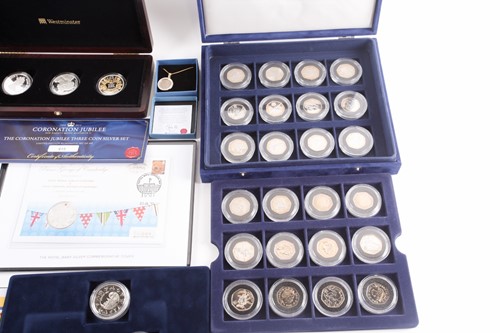 Lot 317 - Seven boxed commemorative coin sets,...