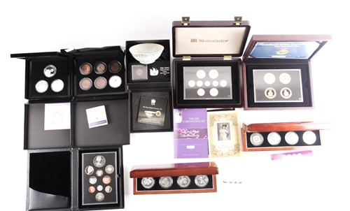 Lot 318 - Eight boxed sets of commemorative coins,...