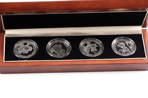 Lot 318 - Eight boxed sets of commemorative coins,...