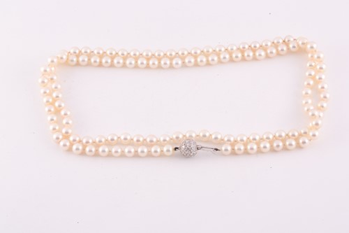 Lot 213 - An opera length cultured pearl necklace,...
