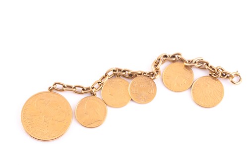 Lot 74 - A yellow metal bracelet, suspended with six...