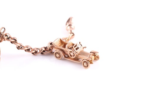 Lot 55 - A yellow metal converted watch chain charm...