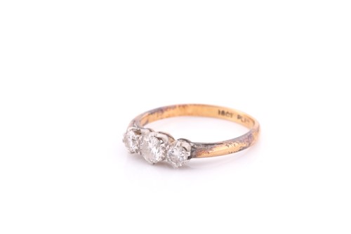 Lot 267 - A three stone half hoop diamond ring, the...