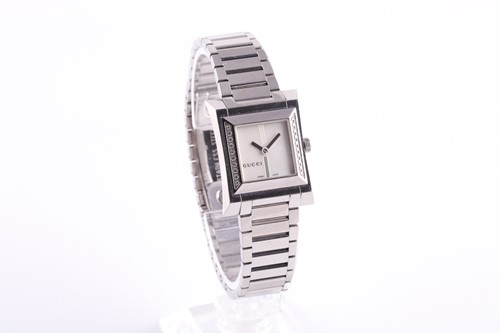 Lot 521 - A ladies stainless steel watch by Gucci, with...