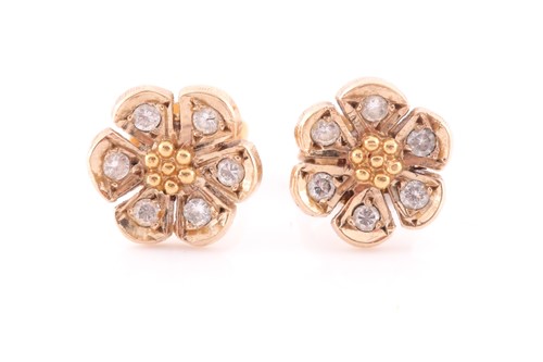 Lot 120 - A pair of yellow metal and diamond floral...