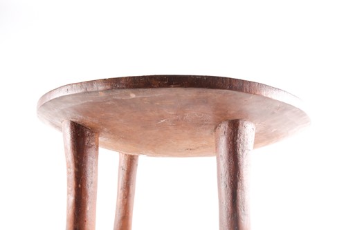 Lot 259 - A Kamba stool, Kenya, the circular top inlaid...