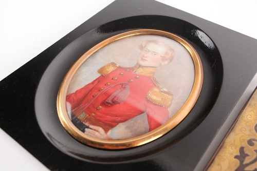 Lot 180 - A 19th-century oval portrait miniature on...