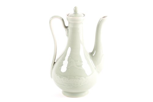 Lot 247 - A Chinese celadon wine ewer, modelled in the...