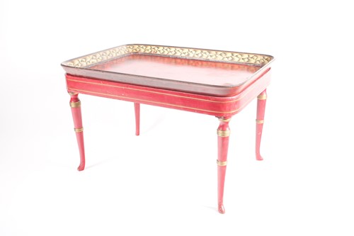 Lot 122 - A red-lacquered tray on stand, with painted...