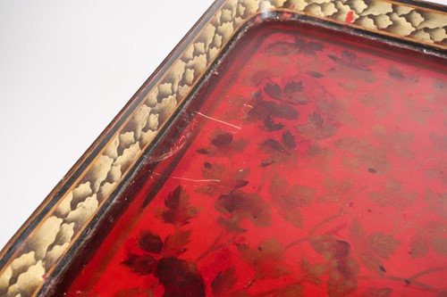 Lot 122 - A red-lacquered tray on stand, with painted...