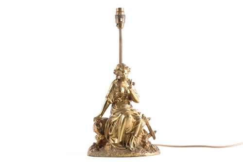 Lot 141 - A gilt-bronze figural table lamp of a lady...