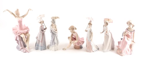 Lot 557 - Four Lladro promenading ladies, each with a...