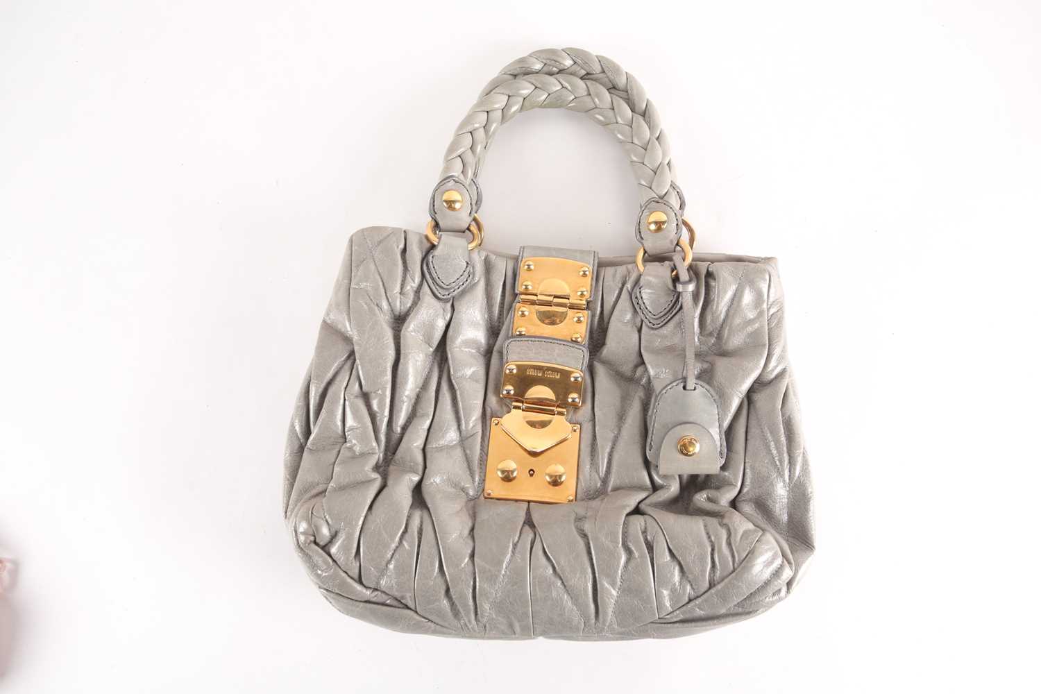 Lot 505 A Miu Miu grey green leather handbag the