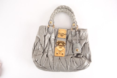 Lot 505 - A Miu Miu grey/green leather handbag, the...