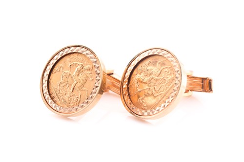 Lot 241 - A pair of yellow metal cufflinks each set with...