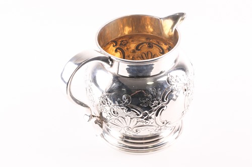 Lot 329 - A late Victorian silver water jug, London 1897...