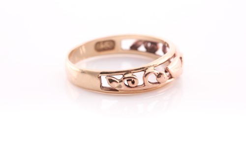 Lot 234 - A 9 ct and rose gold Clogau band ring, size Q,...